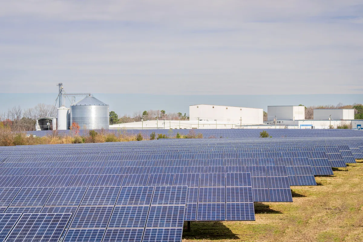 Large solar panel array mounted on a commercial building roof
