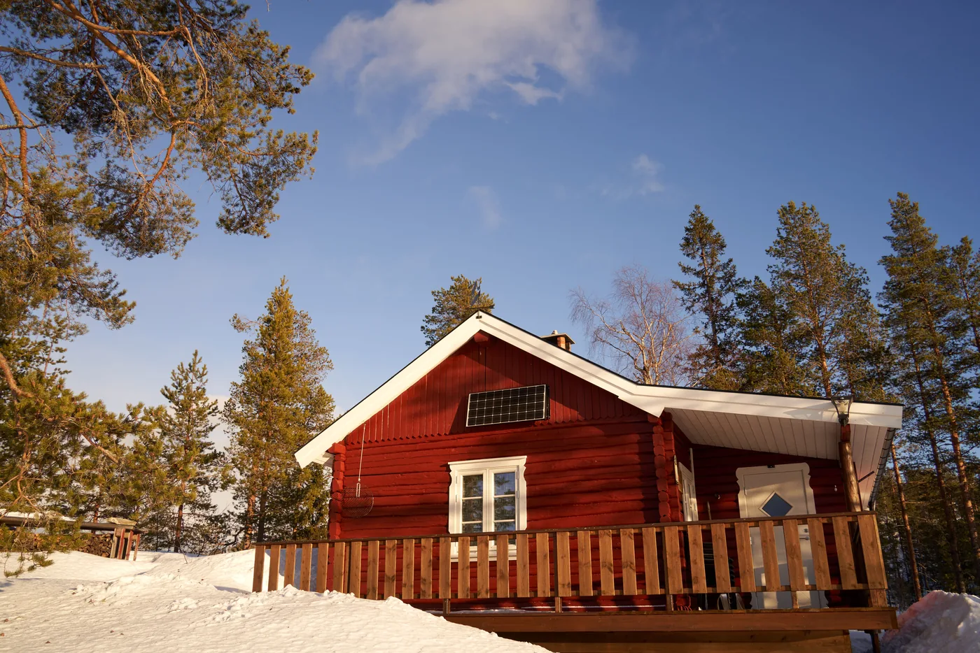 Solar panels supplying power to a remote rural property surrounded by trees