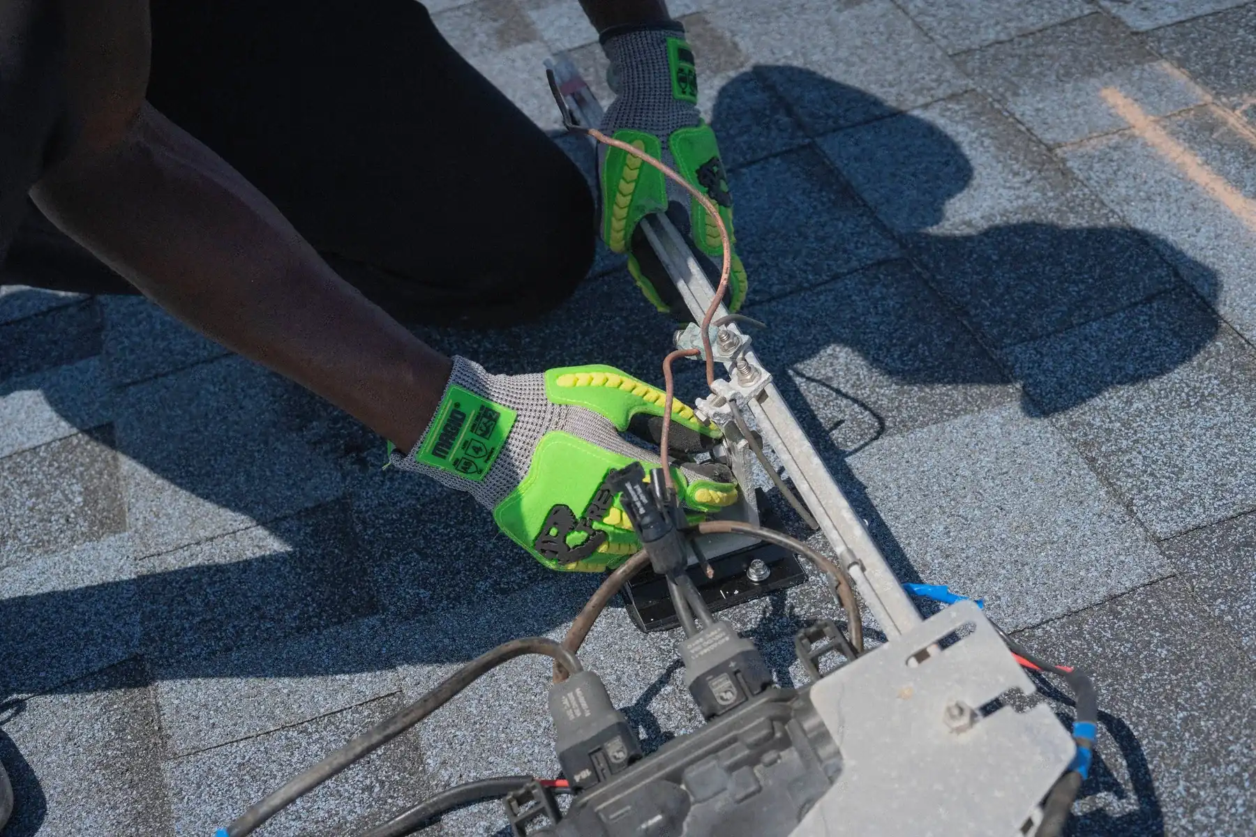 Solar installer at work on a roof