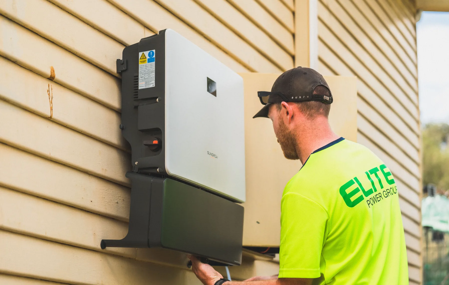 Inverter and battery electrical connections mounted in a utility space