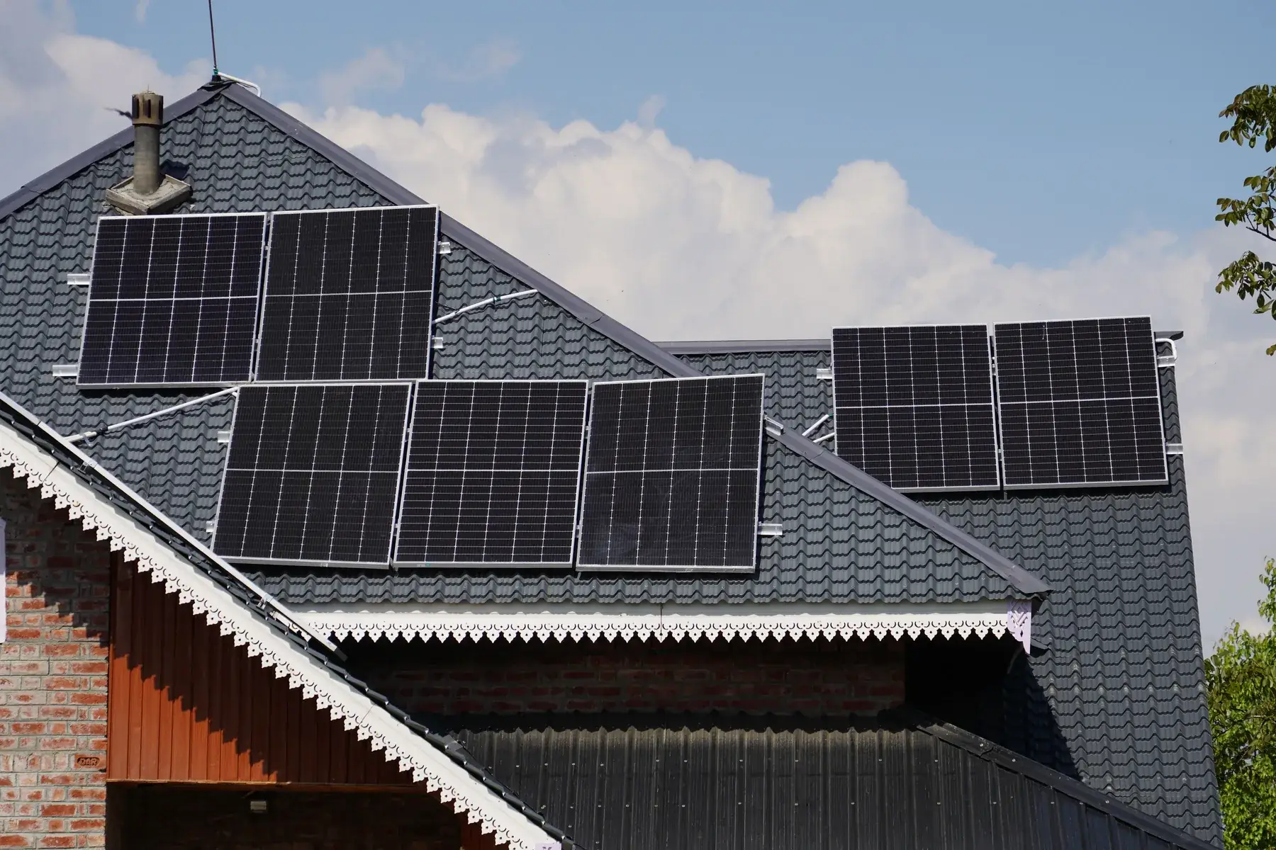 Solar panels on a house roof in bright sunlight